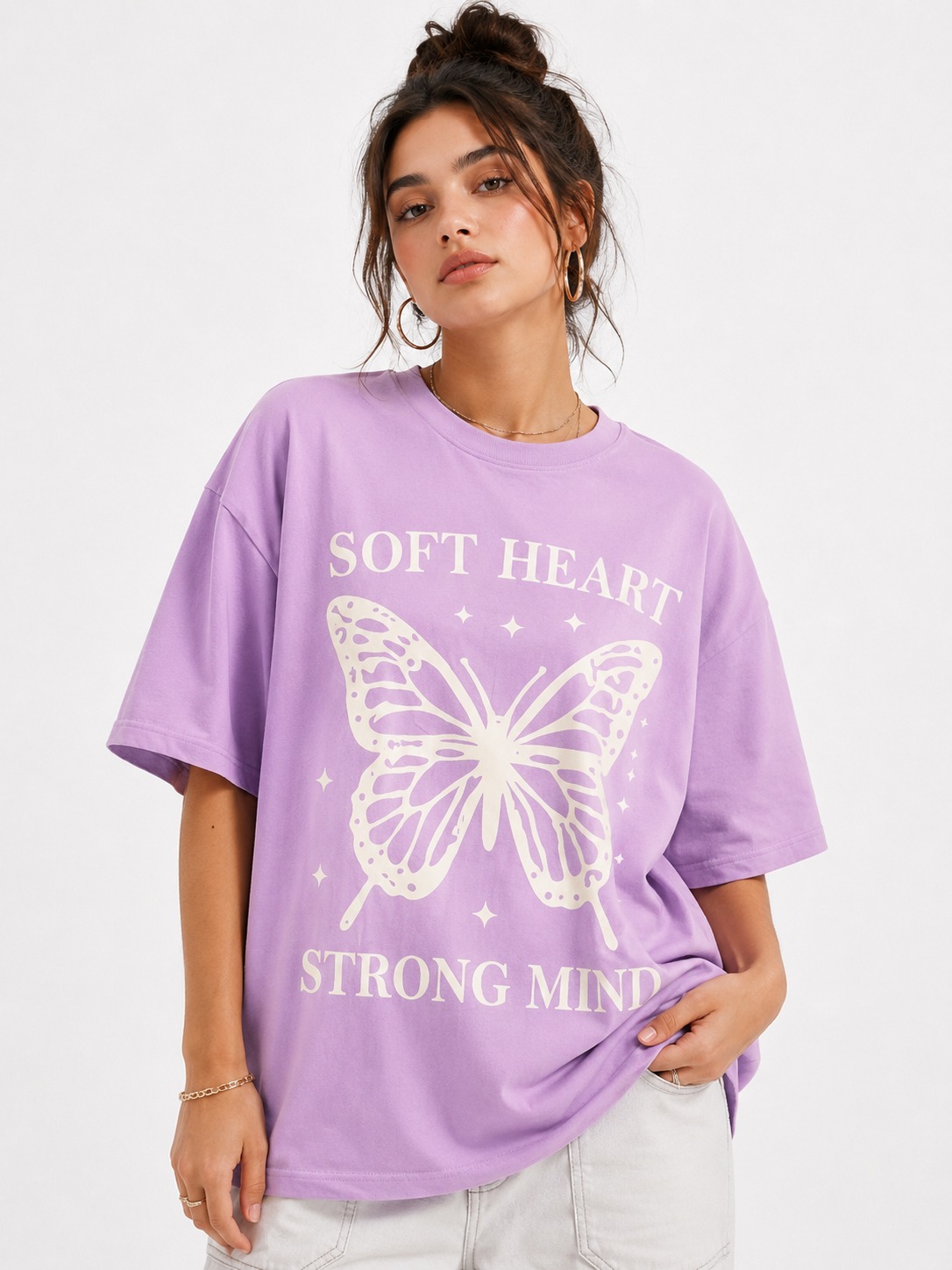 Woman wearing the lavender Soft Heart Strong Mind oversized tee